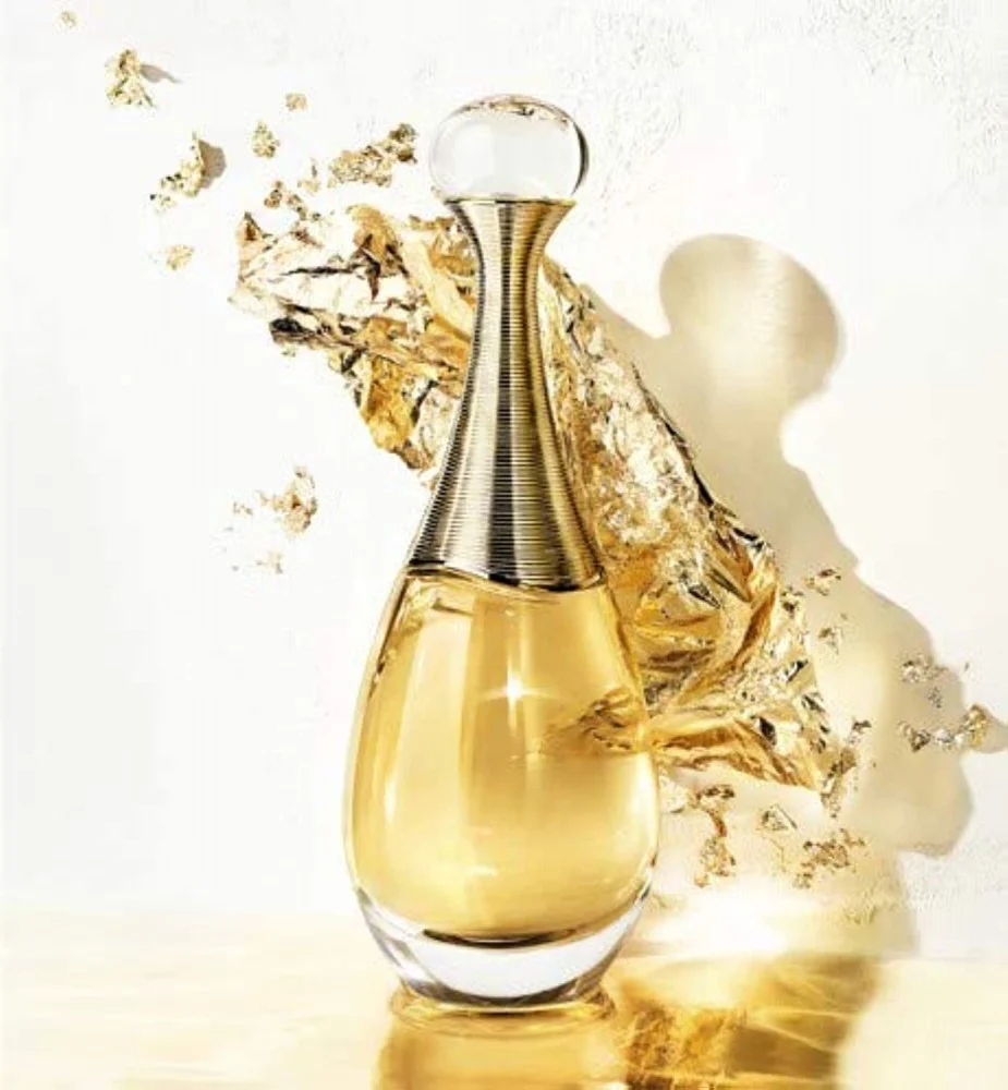 A woman's hand sprays J'adore Dior women's perfume, moments of femininity and attraction